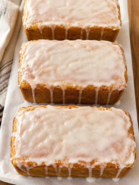 Homemade cinnamon swirl bread topped with vanilla glaze