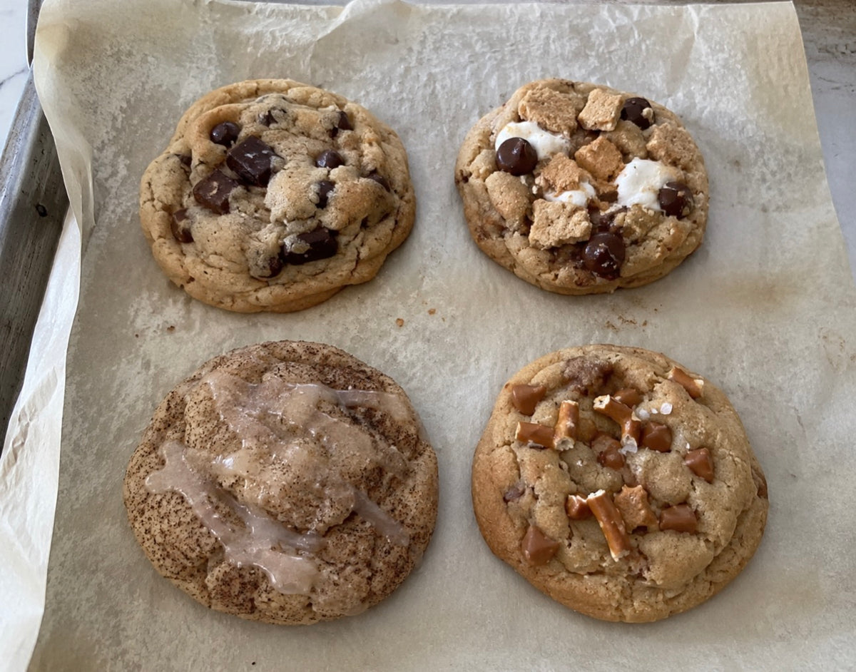 Four Little Acres bakery cookie flight with chunky chocolate chip, s’mores, cinnamon roll snickerdoodle and salted caramel pretzel cookies