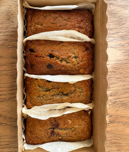 Banana bread flight with classic, chocolate chip, walnut and raisin mini loaves