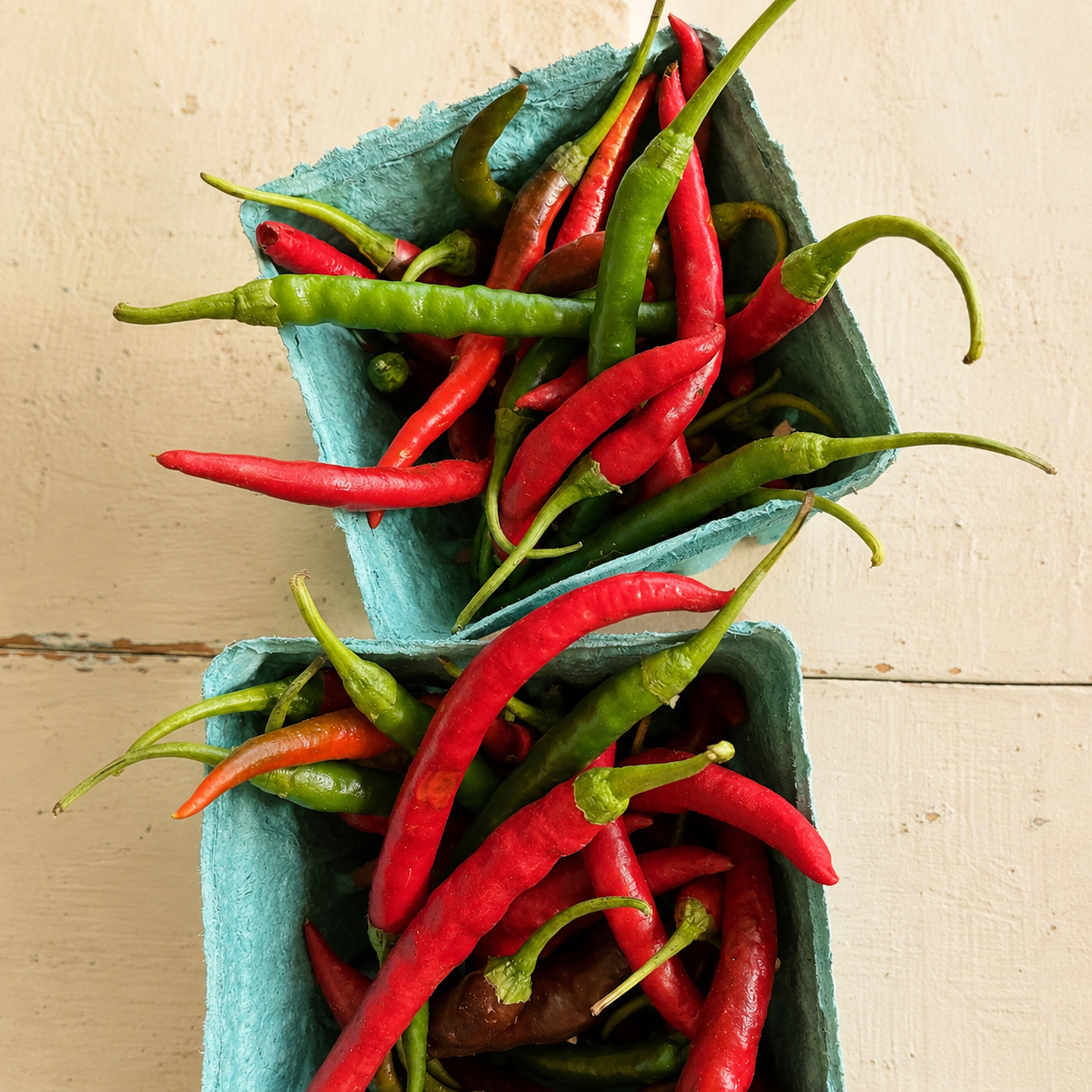 Fresh garden-grown cayenne peppers from Four Little Acres