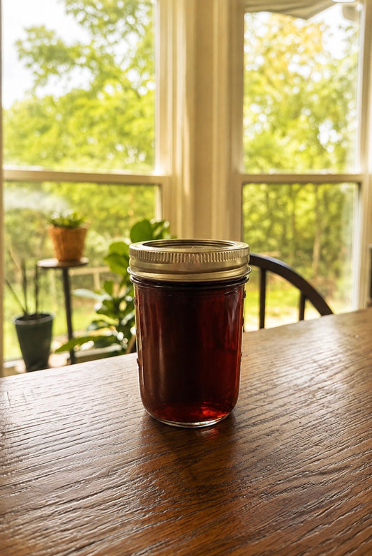 Half pint jar of homemade Harvest Maple Syrup from Four Little Acres